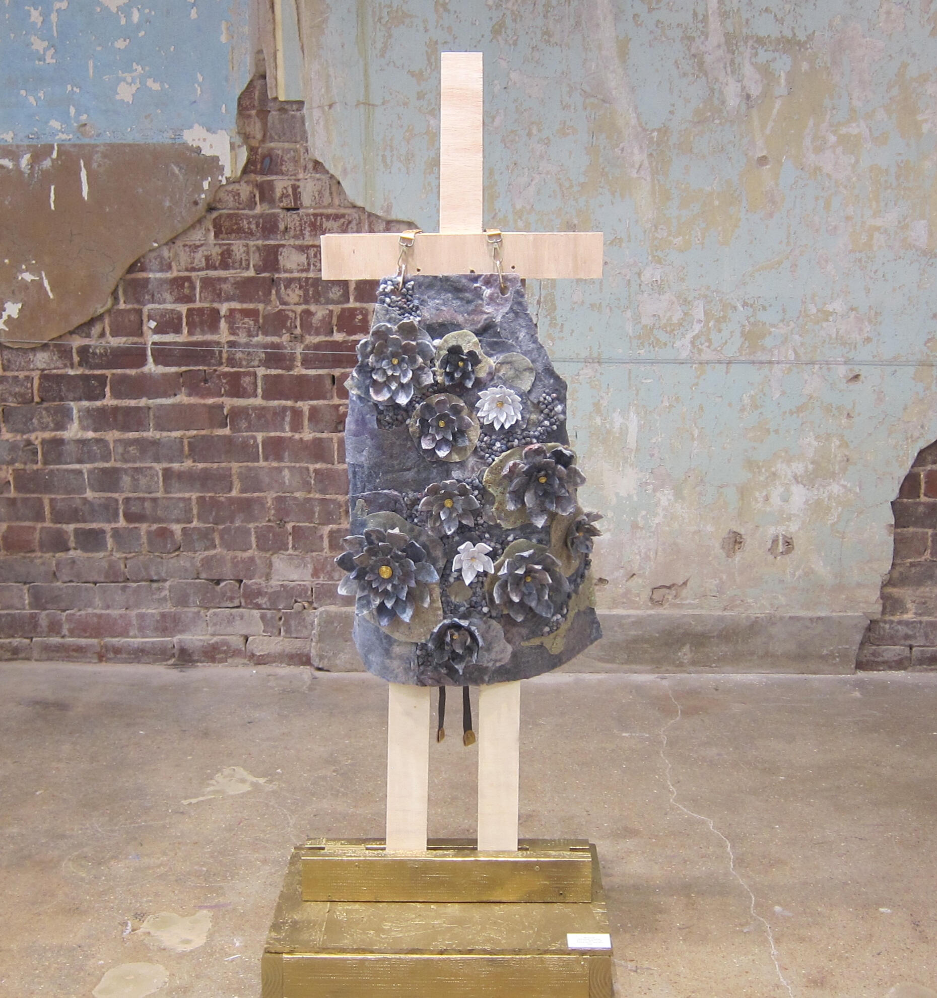 Matriarch (dryer lint, gold thread, canvas apron, wire)